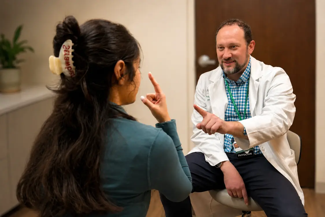 A RUSH neurologist in consultation with a patient