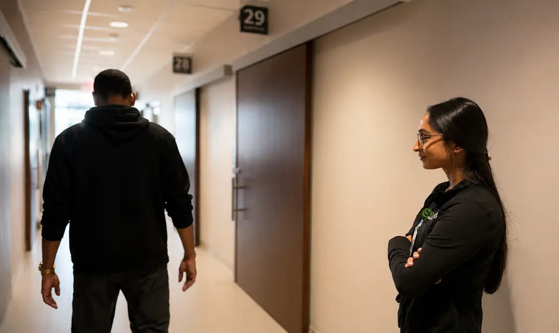 A RUSH coordinator reviewing paperwork with a patient