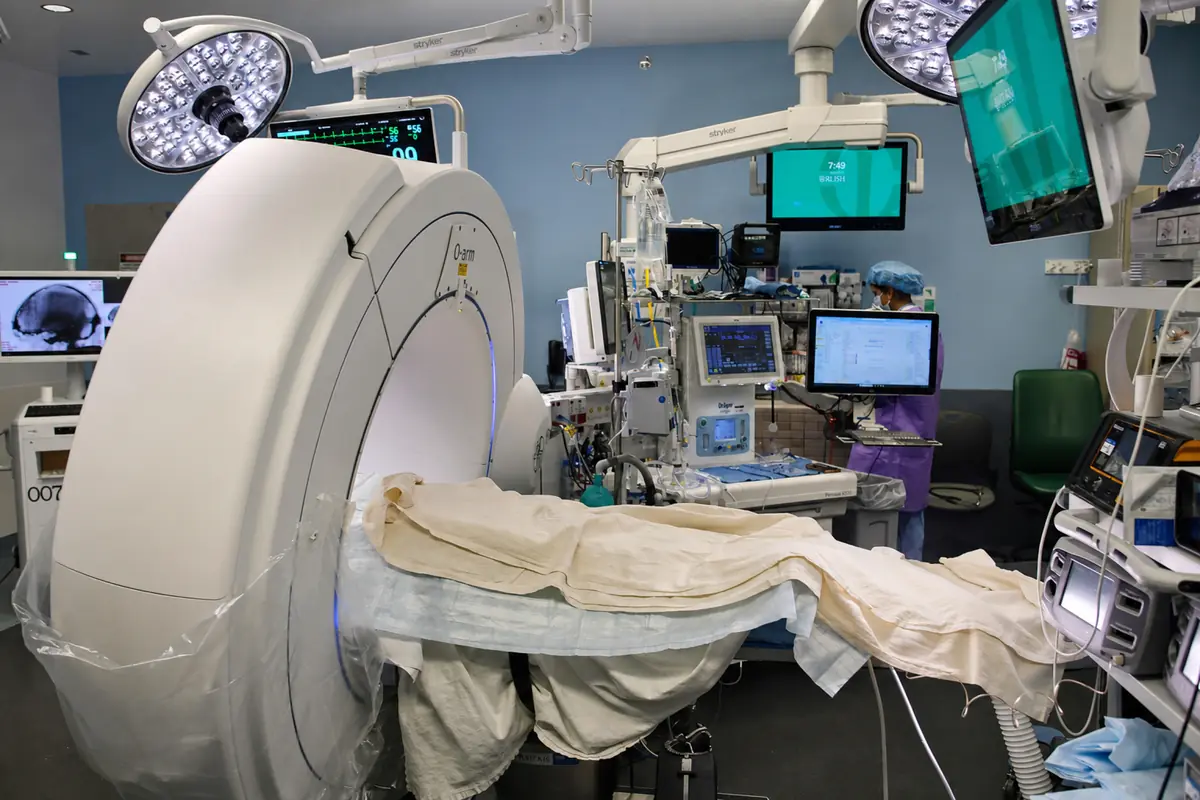 The RUSH functional neurosurgery operating room with the intraoperative CT scanner in position beside the table