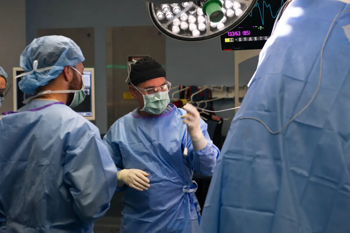 The surgical team gowned and gloved at the start of a DBS procedure